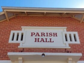 Parish Hall Gallery exterior, showcasing red brick and large red text 