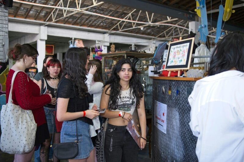 Gen Z crowd lining up inside warehouse vintage store in Adelaide CBD