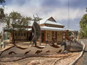 Gallery building displaying a rain moth wing fountain, including other metal & mosaic art work.