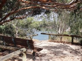 The shaded seating area offers a view to the Landing below.