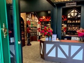 A green door stands ajar, inside is a large shop with lots of German Products