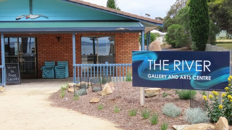 gallery building with sign and garden