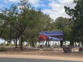 Road view of Waik Cemetery Strangman Rd signage