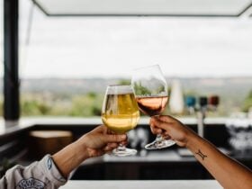 Enjoying a glass of cider and a glass of wine on the Chalk Hill deck