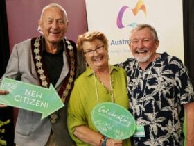 Three people celebrating new citizenships