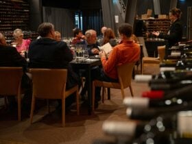People seated around a table in the National Wine Centre