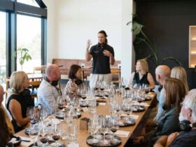 The host is deliving the sensory odyssey experience to a gourp of guests