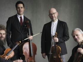 Brooklyn Rider string quartet with their instruments.