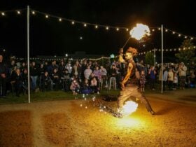 Fiery Fridays - Fire performance with festival bunting and crowd
