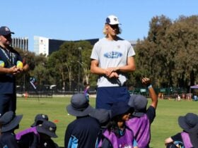 Geelong Player talking with children
