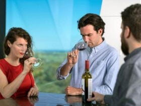 A couple smelling their wine before tasting