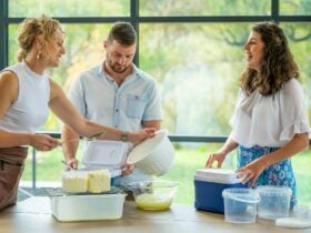 3 people talking and making cheese