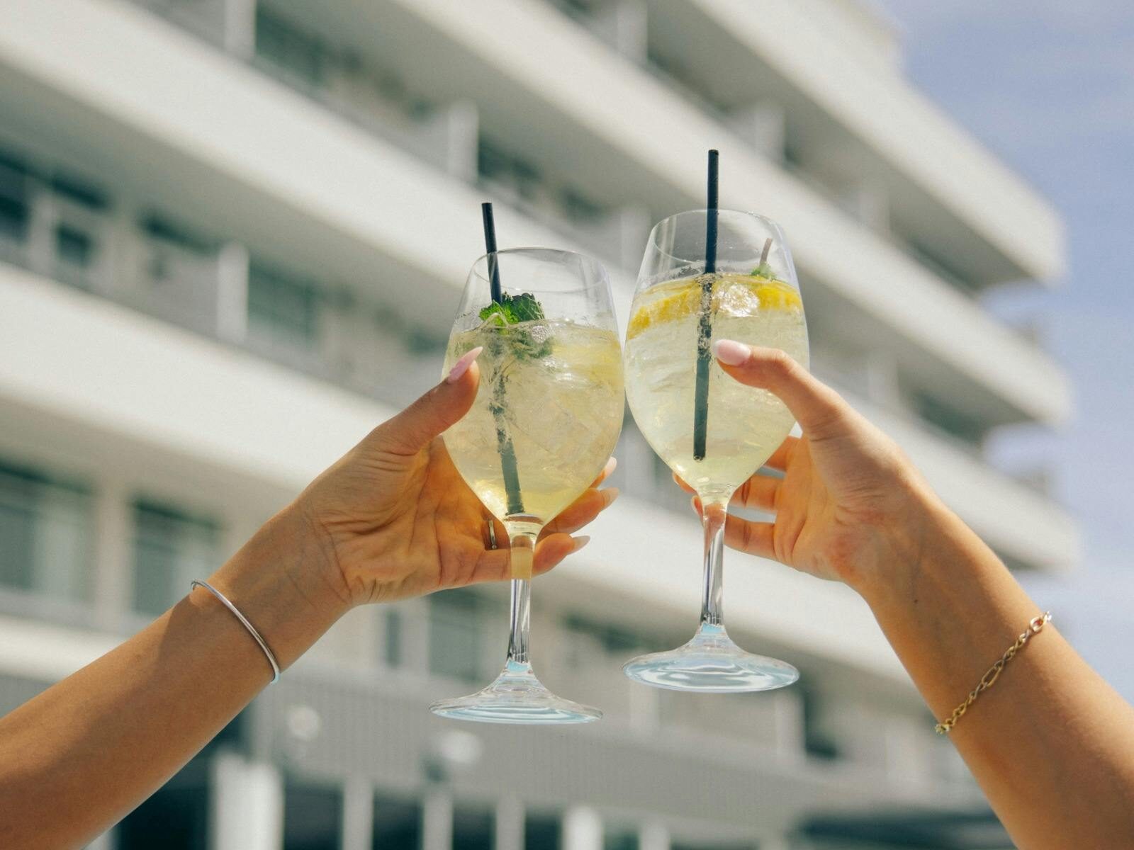 Two spritzes cheersing outside infront of the hotel