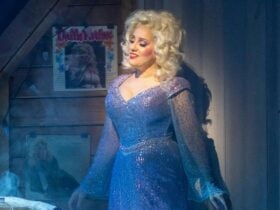 woman with blond hair and blue nightgown with spotlight on her