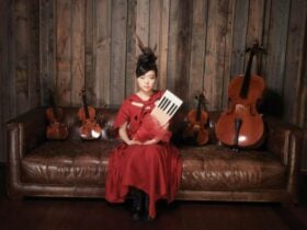 Lady is holding a piano flower