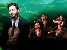 Lawrence Power and the ACO performs. A backdrop of lush green hills.
