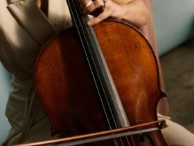 A close up photo of a cello being played.