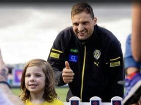 Richmond FC player with a fan