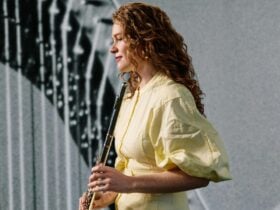 A flautist holding her instrument