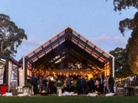 Image of Lot.100 building from the outside with people standing around