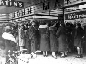 Shoppers in the 1940s wait to get inside John Martin
