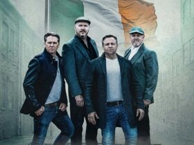 High kings standing in front of irish flag
