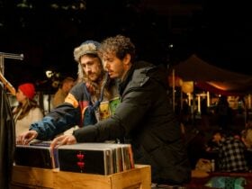 Two men browsing vinyl at an outdoor market