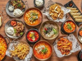 A vibrant spread of Korean cuisine featuring a variety of traditional and modern dishes, including s