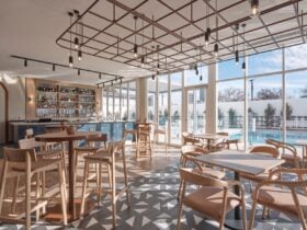 Bar space at ela with a view of the pool