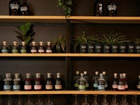 Display shelves at a taproom featuring a variety of craft spirits from Five Eleven Distilling.