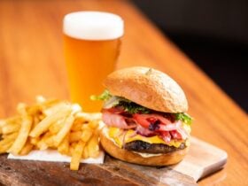featuring an angus beef pattie, bacon, sliced cheese, salad & a side of fries