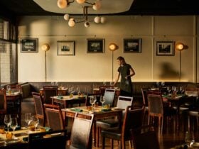 Interior of Osteria Polpo, showcasing its elegant Venetian-inspired design with warm timber paneling