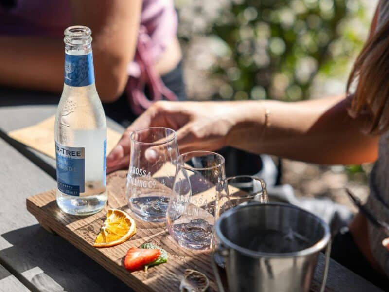 Woman enjoying a gin tasting paddle at Barossa Distilling Co.