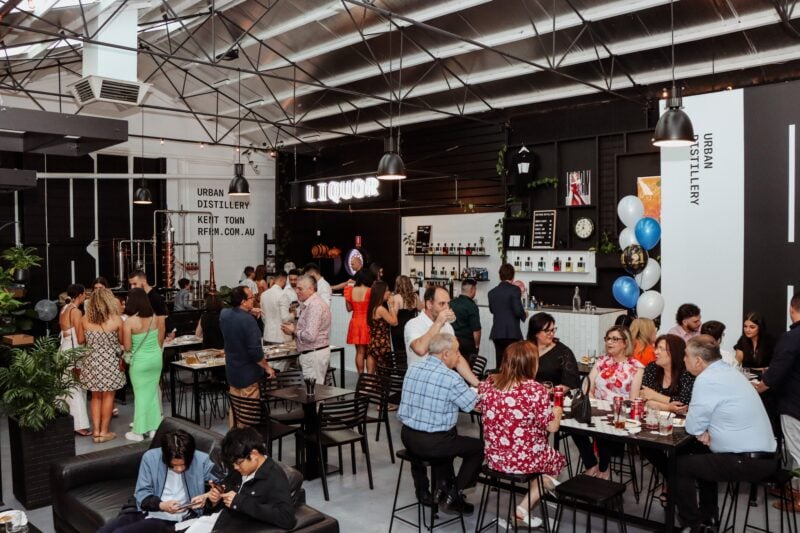 View of inside of reform during a busy event with approximately 40 people