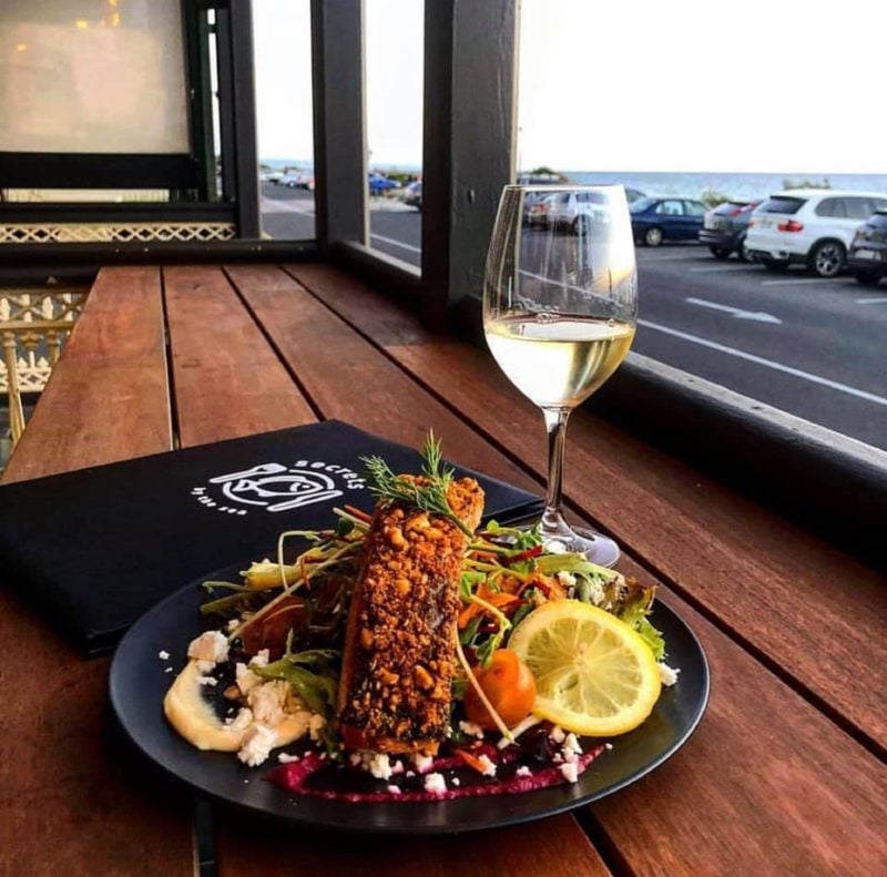 Crispy Skin Atlantic Salmon served with herb mash, green vegetables and dill cream