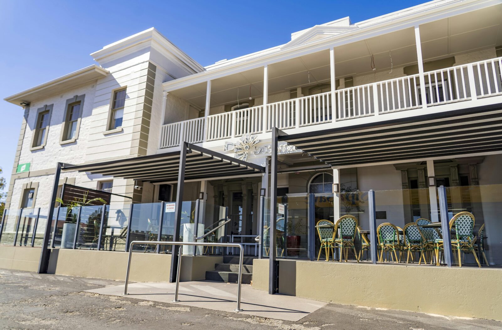Front of The Bushmanâs Arms Hotel featuring a spacious alfresco dining area and elegant architecture