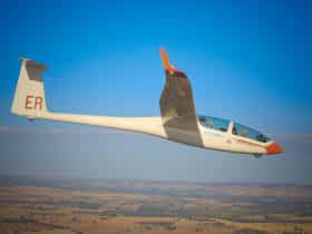 2 people enjoying a glider flight