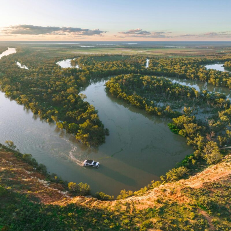 Aerial pic of houseboat on a meandering river