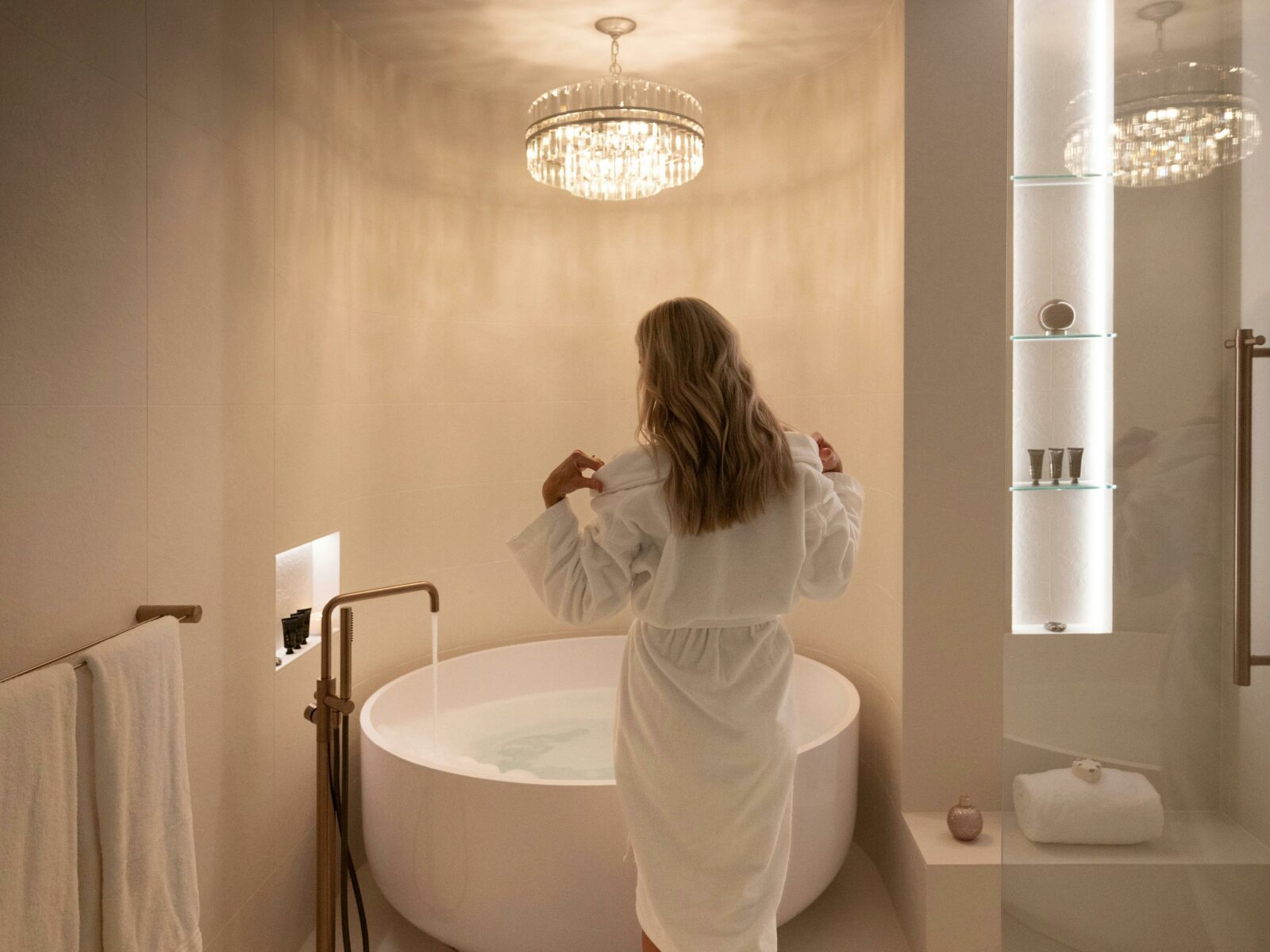 A woman is running a spa bath