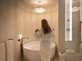 A woman is running a spa bath
