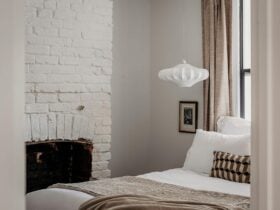 Convict brick walls, crisp white linen and antique touches