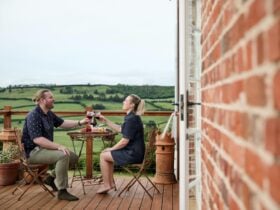 Couple enjoying wine on the deck
