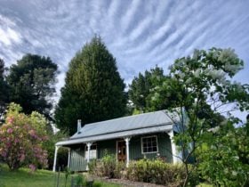 the cottage has 3 outdoor spaces to sit and admire the view, a veranda, balcony and deck out back.