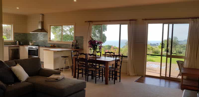 Spacious living area with gorgeous ocean and garden views