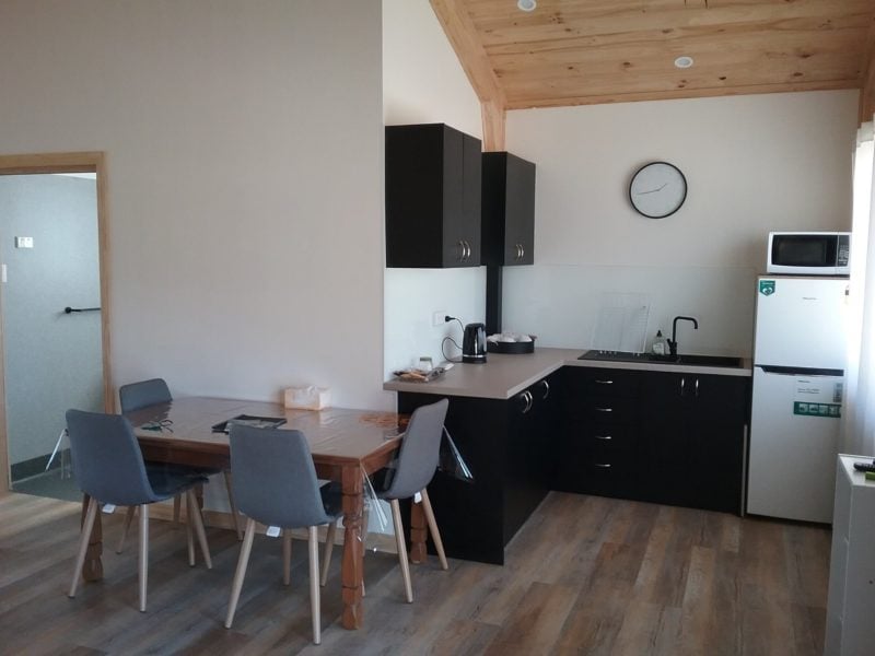 Open kitchen dining area linked to lounge area. All vinyl flooring through cabin