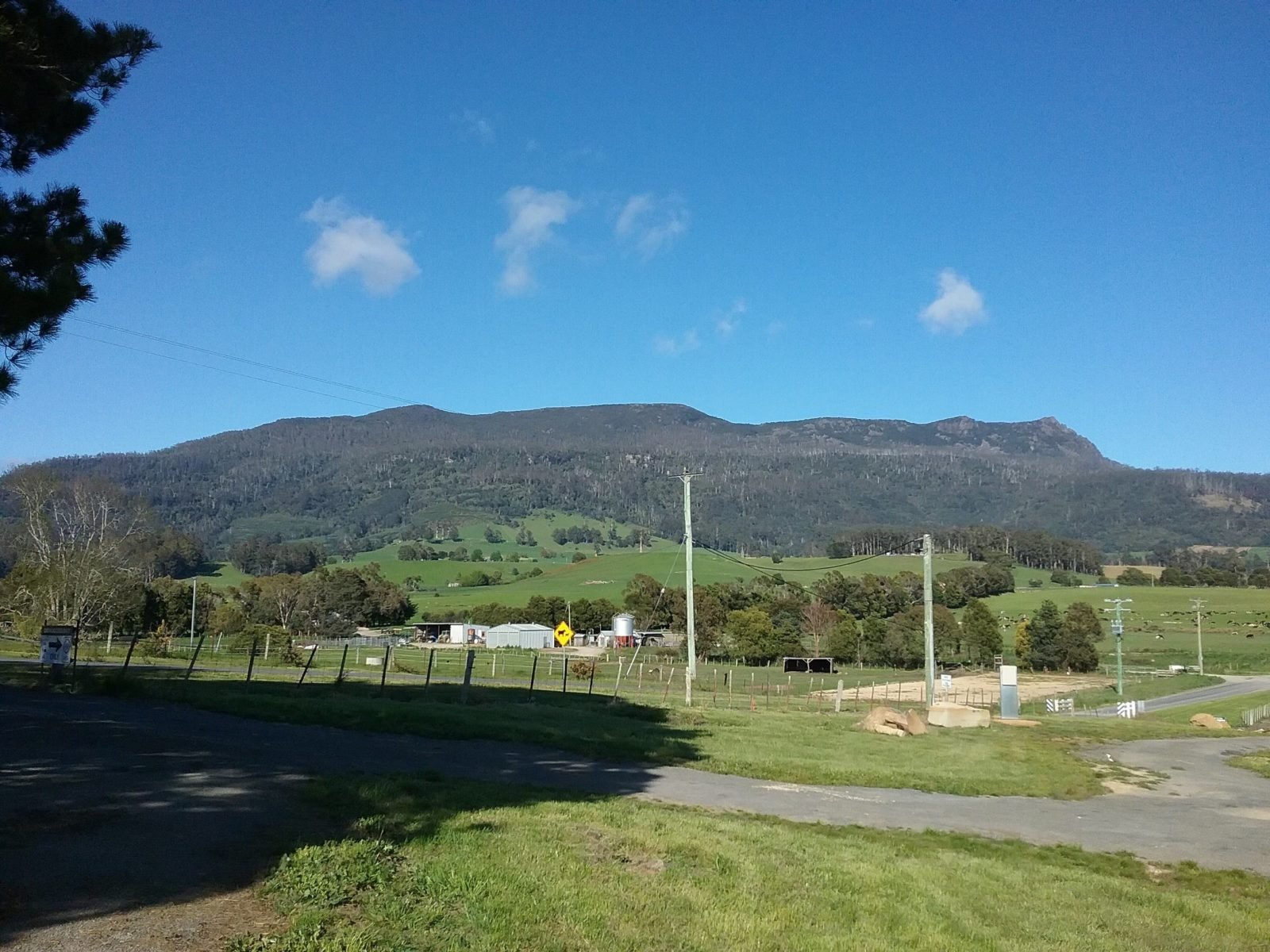 Photo from front of Cabin 3 showing Mother Cummings and agriculture land