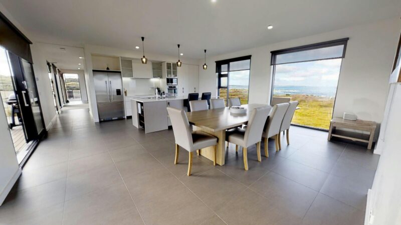 Fully equipped kitchen, ten seat dining setting.