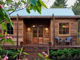 A romantic wooden cottage with retractable veranda roof and movable copper bath