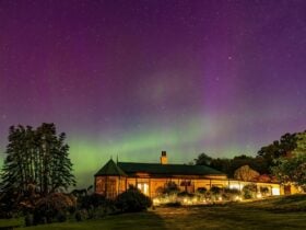 A heritage home against the backdrop of Southern lights in Beauty Point, Tasmania