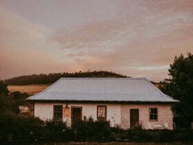 Georgian cottage pictured under a pink dusk sky